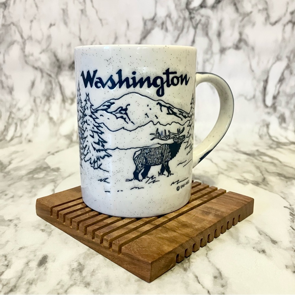 Washington mug with elk (moose?), pine trees, and logging truck